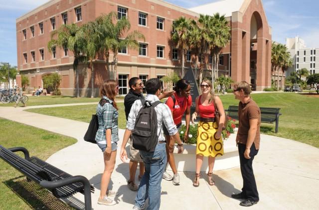 Sudents standing in a circle outside